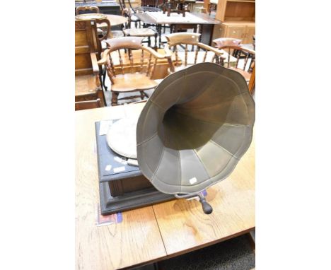 An early 20th century gramophone record player with horn.