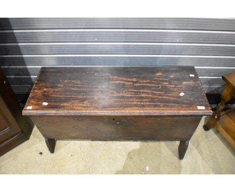 An 18th century oak plank coffer, of oblong form, the lift up top with incised linear and dog tooth decoration, opening on ir