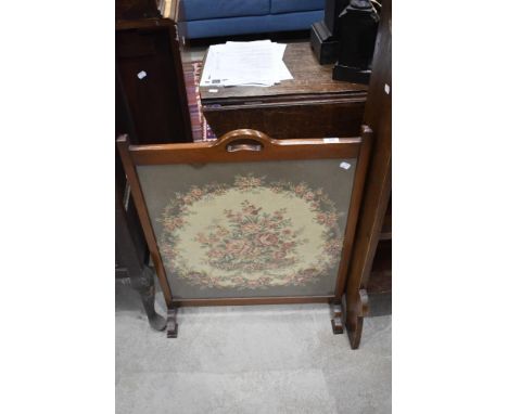 An mahogany and tapestry fire screen with integral handle to top rail 79cm