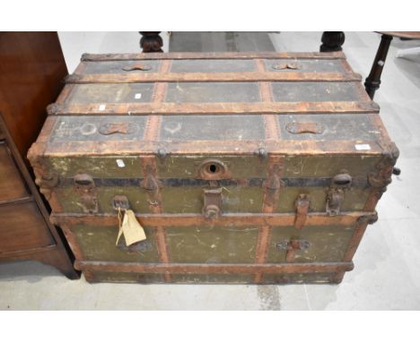 An antique travel trunk strong box with wooden and leather banding over painted canvas. 110cm x 65cm x 55cm