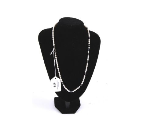 A baroque-oval freshwater-pearl single row necklace. With black-stained fresh-water pearls at intervals, on a bolt-ring clasp