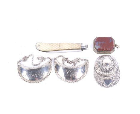A group of interesting silver items. Comprising; an early 19th century agate mounted canted-rectangular vinaigrette with foli