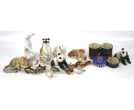A collection of mid century ceramic animal figures. Including Wade Disneys lady and the tramp characters in original packagin