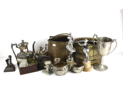 A collection of assorted metalware items. Including a silver plated teapot, two flat irons, two brass coal buckets and coins,