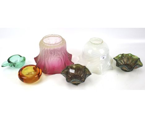 A collection of assorted coloured glassware. Including two lamp shades, two ashtrays and carnival glass. Max. H15.5cm