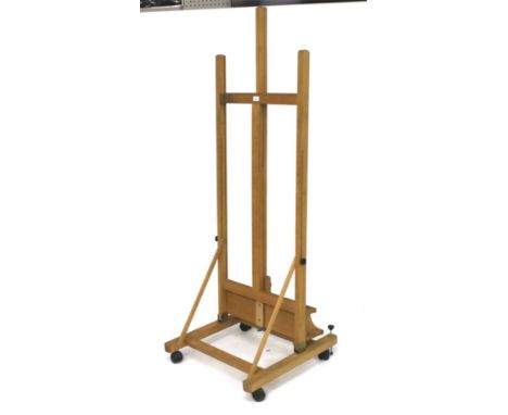 A contemporary pine extendable studio easel. On casters, H171cm