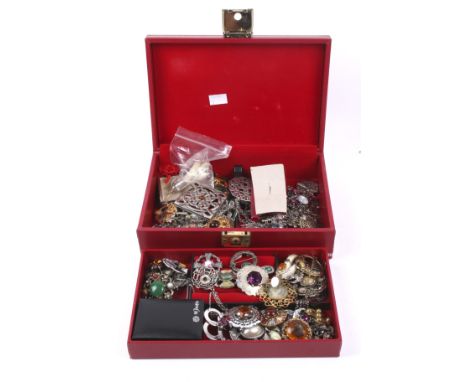 A large collection of 'Celtic' design and Scottish influenced costume jewellery. lncluding a large variety of brooches, sever