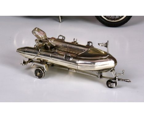 An Italian sterling silver model of a dinghy / rib and trailer by Sacchetti, the well detailed model marked to side Sacchetti