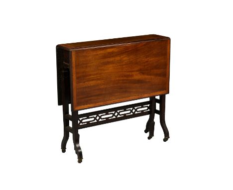 An Edwardian satinwood banded mahogany Sutherland table by Bartholomew & Fletcher, the rectangular top opening on a gateleg m