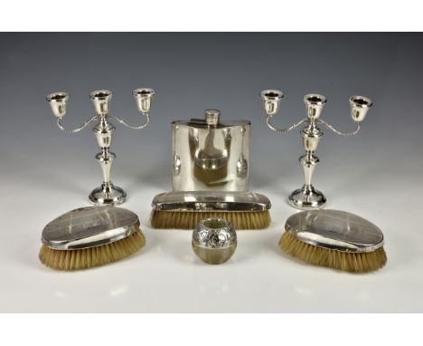 A small collection of silver smalls, to include a pair of vintage weighted table candelabra by A. L. Davenport Ltd., Birmingh