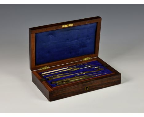 An antique cased technical drawing set, the hinged lid opening to reveal a pull-out tray with fitted tools, unmarked. 