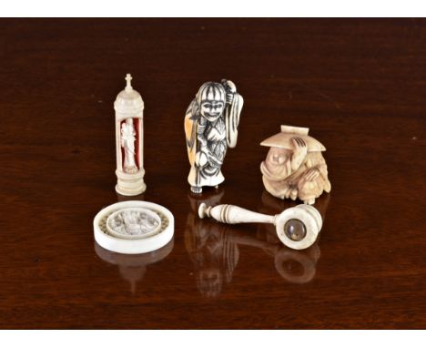 A small collection of antique ivory curiosities, to include two Japanese carved ivory netsukes of figures, the largest standi