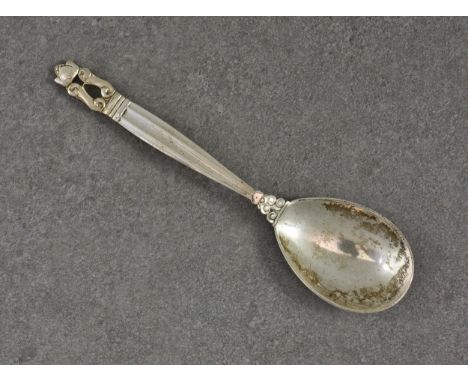 A Georg Jensen silver preserve or caddy spoon, London import marks for Stockwell &amp; Co., 1930, with stylised acorn termina