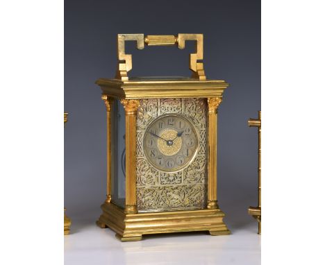 A mammoth gilt brass carriage clock, early 20th century, the Corinthian column case with folding reeded and keywork handle, t