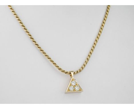A light yellow diamond and 18ct yellow gold necklace., The three brilliant cut diamonds weighing approximately 0.9ct set into