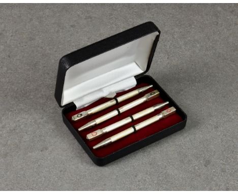 A cased set of silver bridge pencils, William H Manton, Birmingham 1998, of typical form, having enamel playing card suits to
