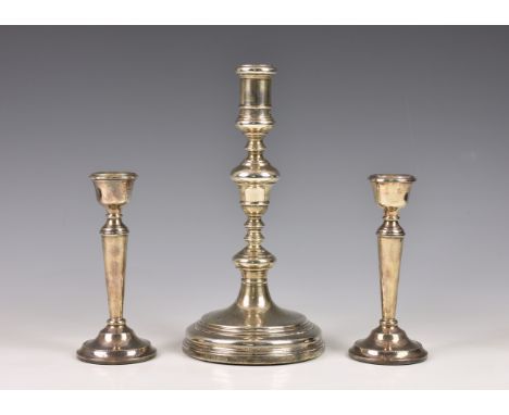 A George II style silver candlestick, Charles &amp; Richard Comyns, London, 1924, of typical form having knopped stem, raised