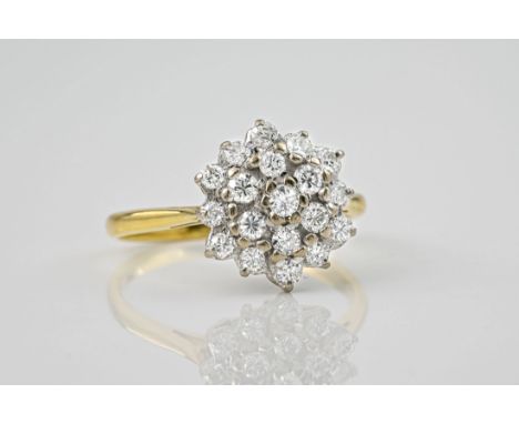 An 18ct yellow gold and diamond cluster ring, the three-tier cluster of nineteen brilliant cut diamonds weighing approx. 0.45