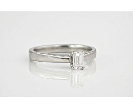 A platinum and emerald cut diamond solitaire ring, the diamond totalling 0.33ct, ring size L. 