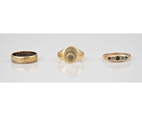 A trio of vintage 9ct gold rings, a plain wedding band (with engraving to the inside), a signet ring and a boat ring with red