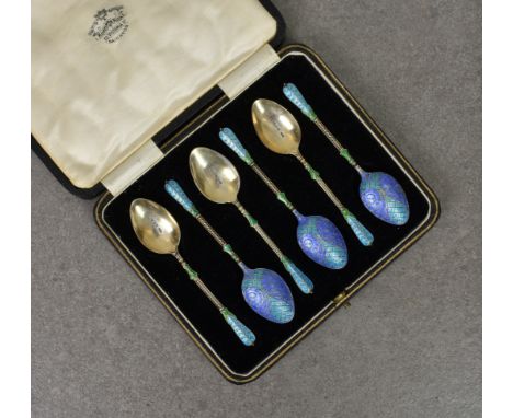 A cased set of six silver and enamel demitasse spoons, Turner &amp; Simpson Ltd., Birmingham 1932, with fancy terminals and b