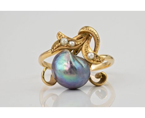 An Art Nouveau style 18ct gold, baroque black pearl and seed pearl ring, the single baroque black pearl nestled within seed p