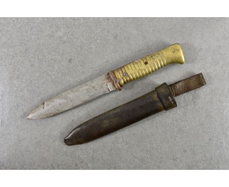 A WWI trench knife and leather scabbard, shortened from a bayonet, brass and copper ribbed handle, 10½in. (26.7cm.) total len