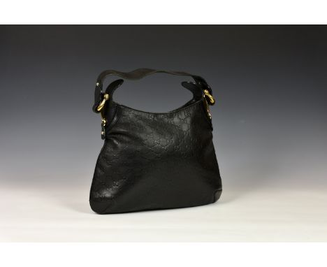 A Gucci Guccissima Creole Hobo black leather monogram handbag, model 145826, with embossed black leather exterior with gold t