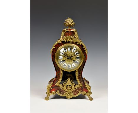 A French Boulle inlaid striking table clock, late 19th / early 20th century, the balloon shaped case with gilt metal scroll a