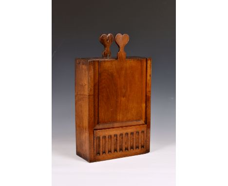 An unusual Georgian mahogany wall hanging wine bottle box, the vertical rectangular box with sliding front door, opening to r