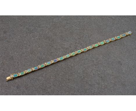 An 18ct gold, opal and diamond line bracelet, the 20 rectangular opals totalling approximately 4.20ct, divided by pairs of br