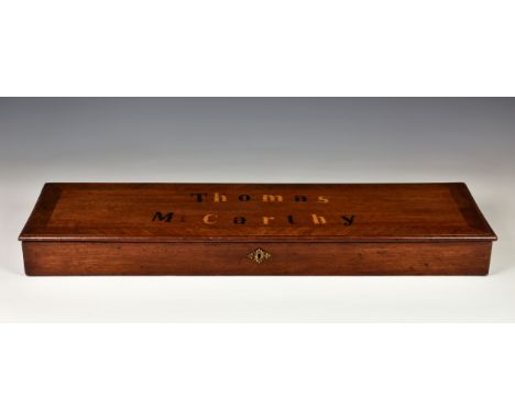 An antique mahogany box - The lid inlaid 'Thomas McCarthy', probably originally a gun case, early 20th century, the lockable 