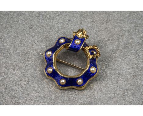 A Victorian 18ct gold, seed pearl and enamel pendant brooch, in the form of a circular looped belt, with decorative buckle an
