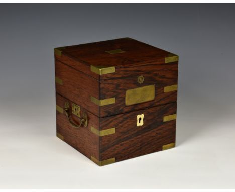 A 19th century mahogany brass bound marine chronometer case, with vacant name plaques to top and front, capped corners, strap