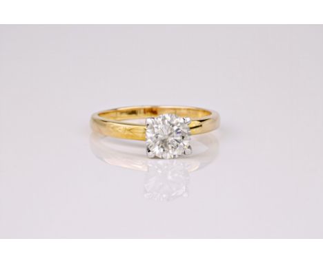 A diamond solitaire ring, the round cut diamond weighing approximately 1ct and set in a 9ct yellow gold band. Ring size M. * 