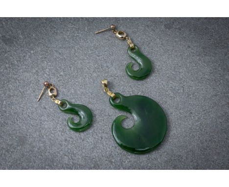 A 14ct yellow gold and New Zealand jade pendant, 53mm. long; together with a pair of matching drop earrings. (3) 