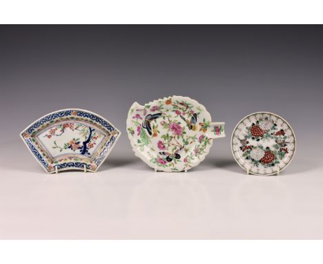 A Cantonese porcelain famille rose leaf shaped dish, of typical form, painted in polychrome enamels, depicting butterflies am