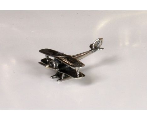 A modern miniature silver model of a biplane, stamped 925, 1 3/8in. (3.5cm.) long, weight 0.25 tr.oz. 