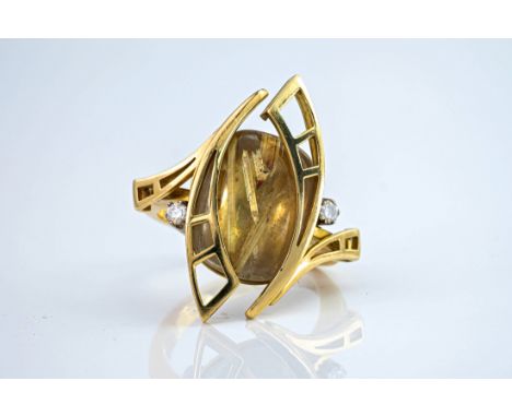 A Catherine Best 18ct gold, rutilated quartz and diamond cocktail ring, of contemporary design and featuring a cabochon rutil