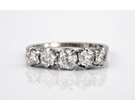 An 18ct white gold and platinum 5 stone diamond ring, the graduating brilliant cut stones totalling approximately 1.13ct. Rin