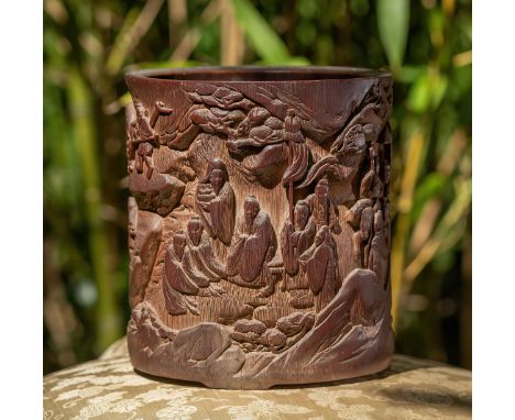 A Chinese carved bamboo brushpot (Bitong), Qing Dynasty, 18th / 19th century, carved in high relief with a group of scholars 