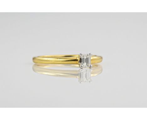 An 18ct yellow gold and diamond single stone ring, the emerald cut diamond totalling approximately 0.28ct and held in a 4 pro