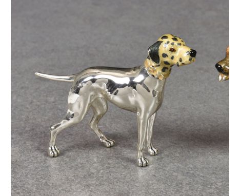 An Italian miniature silver and enamel model of a Dalmatian dog by Saturno, unmarked, standing 2 3/8in. (6cm.) high, nose to 