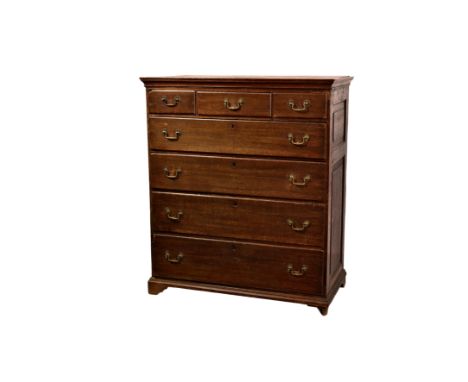 A George III oak tall chest of drawers, the moulded flared top over two panel sides and three short and four long graduated d