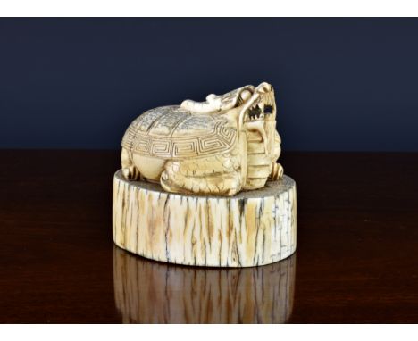 A large Chinese archaic style carved ivory dragon turtle seal, probably 19th century, the dragon turtle with head raised and 