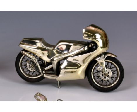 An Italian sterling silver model of a racing motorbike, marked with star - 175 - AR (Arezzo) &amp; 925, with rotating wheels 