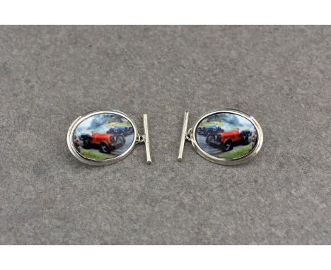 A pair of silver and enamel cufflinks depicting vintage racing cars, stamped 925, the oval form chain cufflinks depicting pre