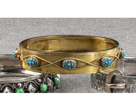 An antique 15ct gold and turquoise bangle, with eight oval turquoise clusters wrapped by rope twist wire. 