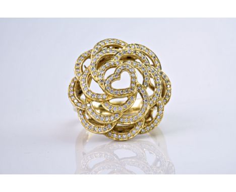 An 18ct yellow gold and diamond floral bombe ring, with loops of yellow gold forming ornate pavé diamond petals and circling 