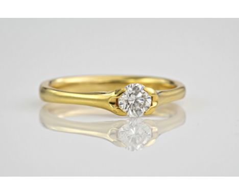 An 18ct yellow gold and diamond single stone ring, the brilliant cut diamond totalling 0.46ct and held above the polished gol